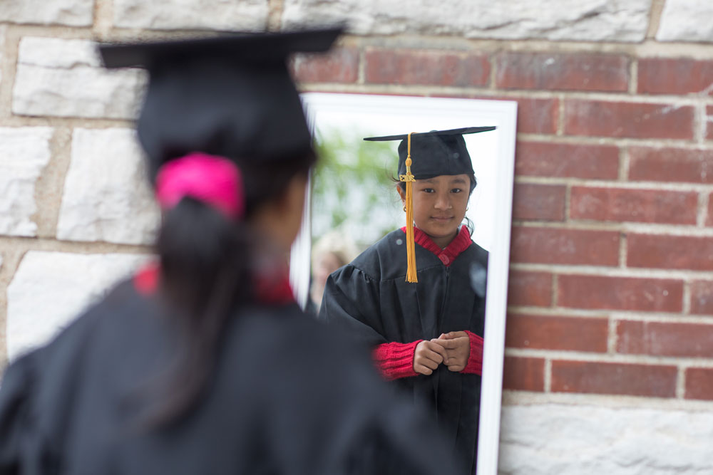 The Little Bit Foundation - young girl in graduation hat